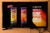 A television shows a Spanish-language advertisement for Kryzpo brand potato chips. Black labels on each can of chips warn they are "high in sodium" and "high in calories."