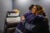 Dionna Brown and her father embrace inside his office.