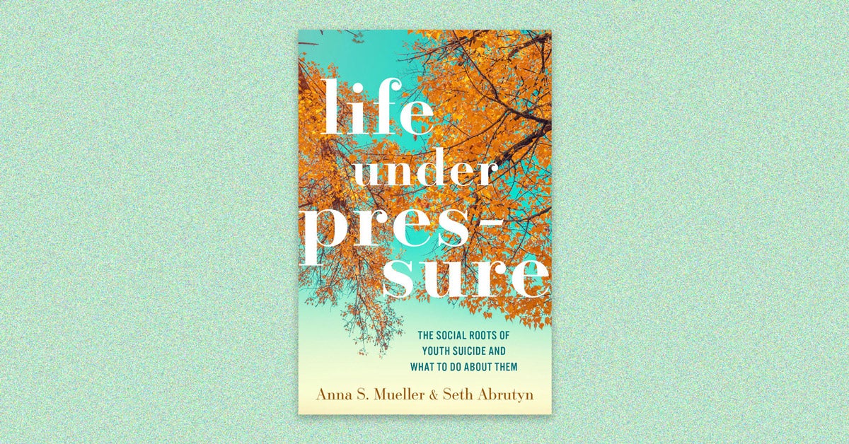Book cover for “Life under pressure: The social roots of youth suicide and what to do about them” by Anna S. Mueller and Seth Arbrutyn; White text on an image of golden tree leaves, looking up. The cover is on a light green speckled background.
