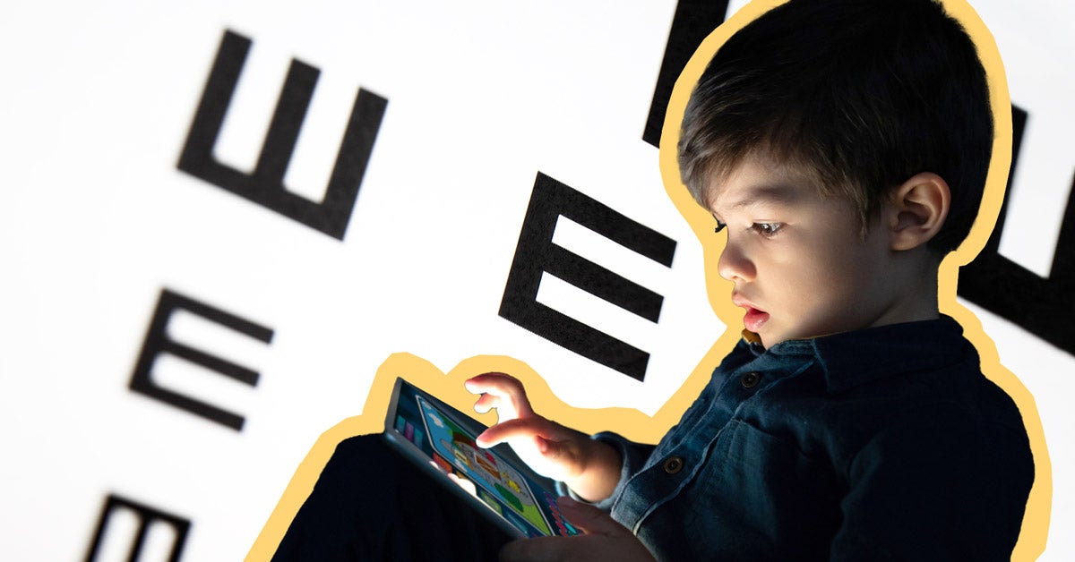 Photo illo: A young boy sits and plays with a glowing tablet. Behind him is an oversized eye chart that blurs on the sides.