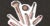 Miscellaneous rose gold cosmetic products are placed against a grey-speckled background.