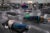 Photo of people lying down on mats on the floor of a large room.