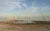 The Salton Sea dried up with a small pool of water and dead trees on a sunny day.