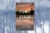 Book cover for “Toms River: A Story of Science and Salvation” on a photo of Toms River, NJ. The background image is black and white with a light blue tint.