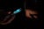 The shadow of a syringe is cast on the arm of a person receiving a vaccine.