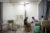 A patient at a Cambodian prosthetics clinic gets his leg checked by a health care worker.