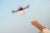 Drone carries first aid box to a pair of outstretched hands.