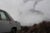 Smoke emissions from a steel plant in rural Pennsylvania. An old car is in the foreground, nearly out of frame.