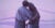 Illustration: Two female figures with their back toward the viewer embrace in a side hug. The figure on the right has a cane. The composition is shades of purple in a non-descript scene.