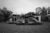 Black and white photo: A destroyed single-story home stands in a plot of land in Louisiana.