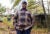 Joe Jackson stands outside his house and looks at the camera.