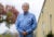 Richard Stevens stands outside a business park and looks at the camera.