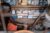 A person receives an intravenous injection of an anti-malaria drug at a small shop in Bangui A technician holds their hand while administering the drug.